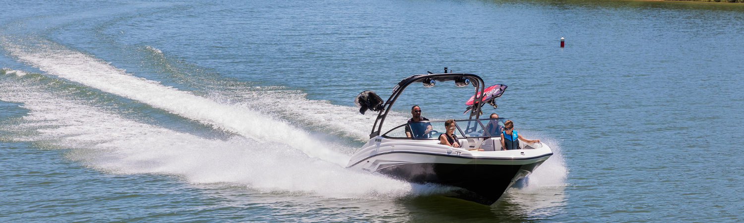 A family boating out on sunny waters with a Yamaha AR190.